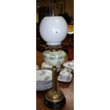 A Victorian Brass and Glass Oil Lamp with shade and globe.