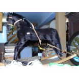 A Straw Stuffed Rocking Horse; on a beech base.