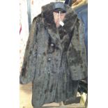 A ¾ Length Brown Fur Coat.