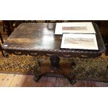An Antique Rectangular Oak Anglo-Indian Style Centre Table; with a pierced shaped frieze, raised