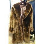 A Vintage Dark Brown Fur Coat, along with a vintage grey chinchilla fur coat.