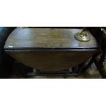 An 18th Century Oak Drop Leaf Gate Legged Table.