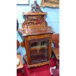 A Late 19th Century Cabinet with mirrored gallery, single drawer over glazed door.