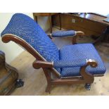 A Victorian Reclining Armchair; upholstered in blue and gold fabric.