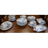 An Extensive Arts & Crafts Dinner Service with very large dinner plates and random artistic