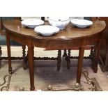 A Pair of Georgian Mahogany Demi Lune Tables, standing on square tapered legs on spade feet, circa