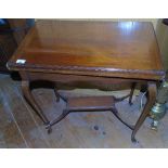 An Edwardian Mahogany Foldover Card Table; of rectangular form with red leather inset on cabriole