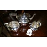 A George V Silver Three Piece Tea Service of Plain Outline. Birmingham: George Unite, 1920. 20.94
