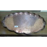 An Arts and Crafts Style Oval Galleried Copper Tray, having engraved decorations of Dolphins