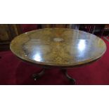 A Victorian Burr Walnut Loo Table; with turned column and four scroll supports.