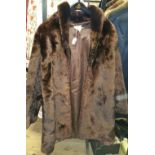 A Vintage Fur Coat with Label, 'Mocklers of Wicklow St, Dublin, Cork....'.