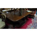 A Wonderful Early 19th Century Mahogany Twin Pillar Dining Table with an extra leaf, on platform