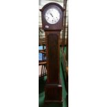 A 1930s Walnut Veneered Grandmother Clock; the silvered dial having Arabic numerals , with