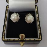 A Pair of White Gold Diamond and Pearl Earrings.