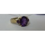 A 9ct Diamond and Amethyst Ring.