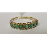 A 9ct Emerald Seven Stone Eternity Ring.