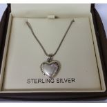 A Silver Locket on a Silver Chain.