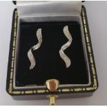 A Pair of White Gold Diamond Set Earrings.