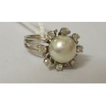 An 18ct Antique Diamond and Pearl Ring.