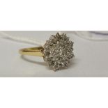 A 9ct Diamond Cluster Ring.