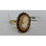 A 9ct Cameo and Garnet Ring.