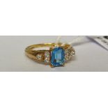 A 9ct Diamond and Topaz Ring.