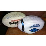 A Signed Mitre Rugby Ball along with an Umbro Example.