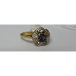 An 18ct Antique Diamond and Sapphire Cluster Ring.