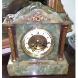 A Green Alabaster Mantle Clock, with reeded brass pillars, with pendulum and key.