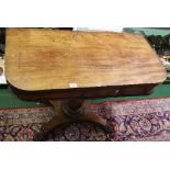 A Regency Mahogany D-End Foldover Card Table; raised on an octagonal vase shaped pillar and platform