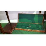 An Early 20th Century Over-and-Under Gun Case, with green baize inner lining, along with a leather