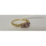 A 9ct Diamond and Amethyst Ring.