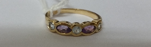 A 9ct Amethyst and Topaz Ring.