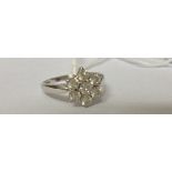 An 18ct Diamond Cluster Ring, approximately 1.4 carat in diamond weight.