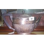 A Victorian Silver Teapot of Half Reeded Form. London, William Hutton & Sons 1898, 19.42 oz.