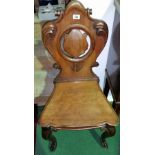 A Good Pair of William IV Mahogany Hall Chairs; with carved acanthus detail, solid seats and