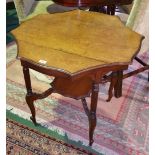 A Late 19th Early 20th Walnut Scalloped Edge Centre Table; with raised under tier and reeded legs on
