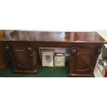 A 19th Century Mahogany Pedestal Sideboard; with panelled doors and three frieze drawers.