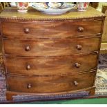 A Superb Georgian Mahogany Bowfront Chest of Drawers, with a beaded edge and four long drawers.