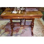 A Victorian Walnut and String Inlaid Rectangular Foldover Top Card Table; with circular baize panel,