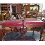 A Really Good Pair of 19th Century Yoke Back Chairs, upholstered in burgundy leatherette and stud