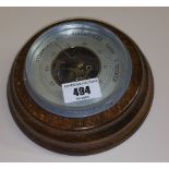 A Small German Made Oak Aneroid Barometer.