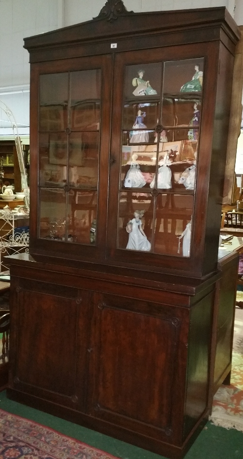 A 19th Century Mahogany Two-Door Bookcase having two glazed doors enclosing six adjustable shelves