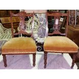 A Pair of Edwardian Rosewood and String Inlaid Nursing Chairs; with pierced carved inlaid splats and