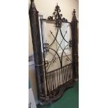 A Fantastic 19th Century Cast Iron Gate and Surround, having columned gothic pillars, a swagged