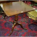 A Mahogany Occasional Table; with square top on turned supports and tripod feet, the top approx.