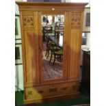 An Edwardian Ash Wardrobe with single bevelled door over drawer. 50in (w). (key(s) in office).