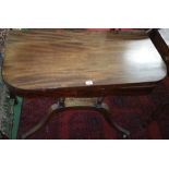 A Good Regency Mahogany Fold Over Card Table; on a reeded quatrefoil platform base with brass