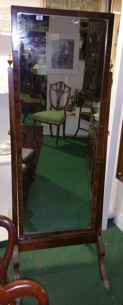 A Superb Quality Regency Cheval Mirror, having shaped and carved legs terminated by detailed brass