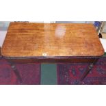 A 19th Century Mahogany Tea Table with reeded edges on four turned supports.